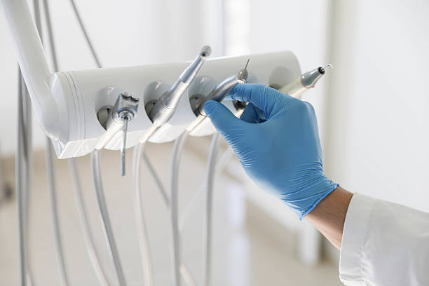 Professional Tooth Extraction technician working in Crainville, IL